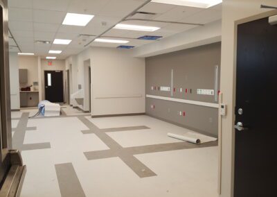 A hallway with a door and a doorway.