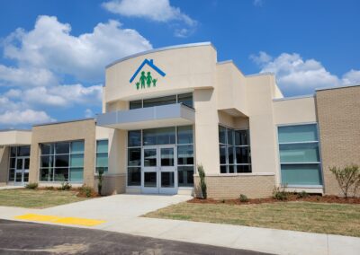 A building with a blue sky and white clouds.