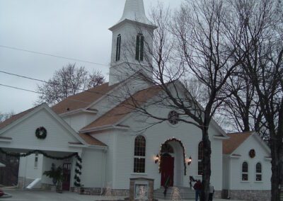 A white church with a steeple.