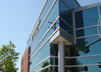 A brick building with glass windows.